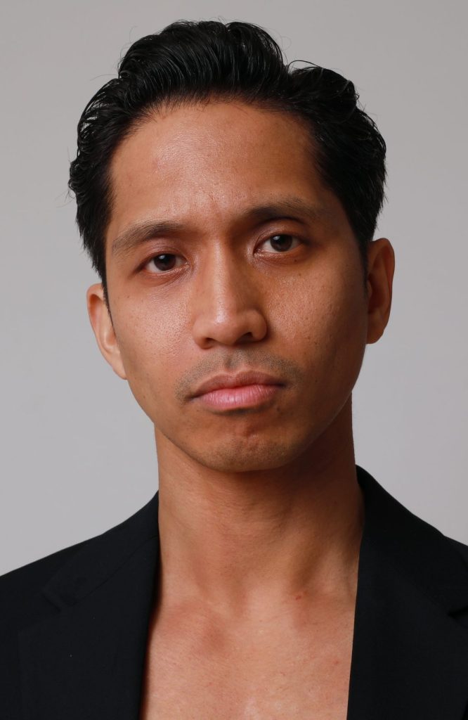 Portrait,Of,Thoughtful,Young,Asian,Man,Posing,Over,White,Background.